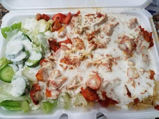 Chicken and rice platter with a salad and lots of white sauce. So good and so filling!!!!