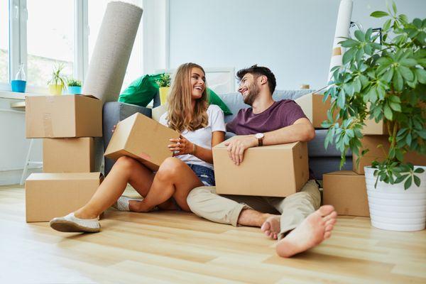 Young couple moving into their first house together.