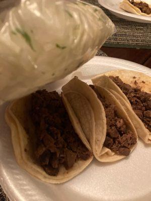 tacos with a bunch of onion but no cilantro