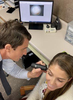 Dr, Webb performing a Video Otoscope