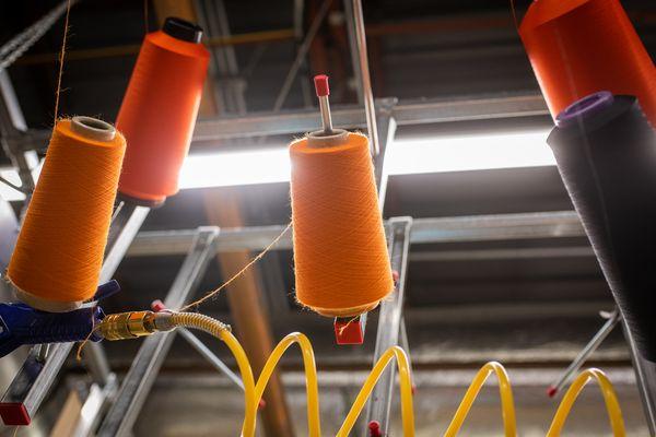 Cones of yarn at the Darn Tough mill, waiting to be knit into socks.