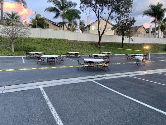 Taped off Outdoor seating with lighting in the parking lot