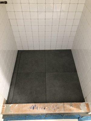 One side slope shower pan. Schluter system waterproof with schluter liner drain