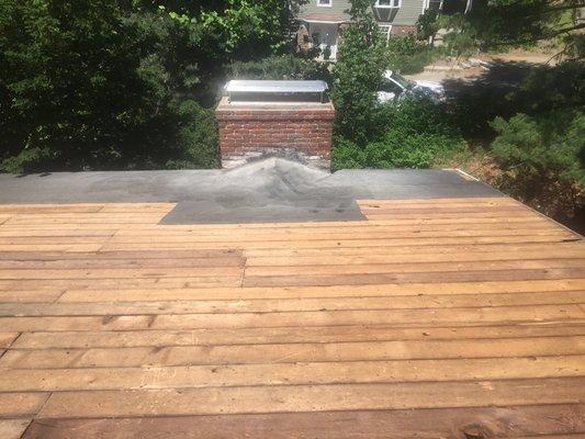 Prepped roof deck prior to new roof installation