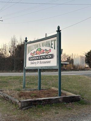 Sign from the road- plenty of parking in the gravel lot