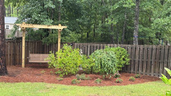 Back corner of our yard is now a peaceful refuge in the shade of our majestic pines and surrounded by fragrant gardenias.