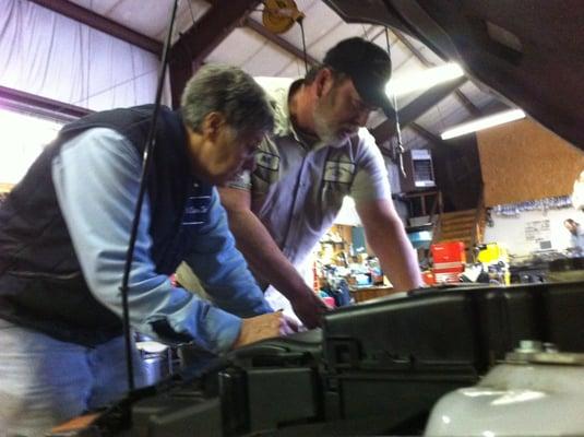 Nancy Lingway and 20+ year employee Bill check out a customers car.