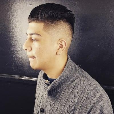 Contemporary mid fade with comb-over top