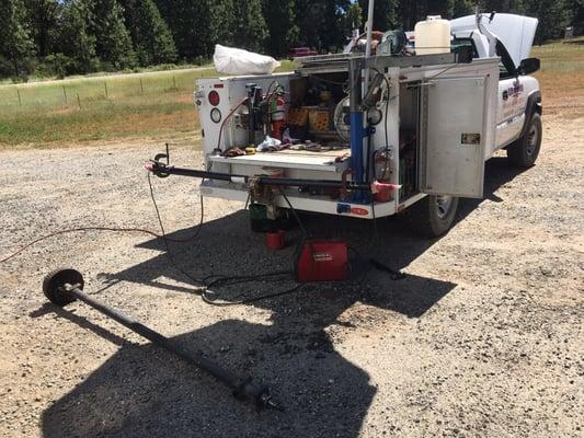 Road side axle install on a broke down travel trailer.