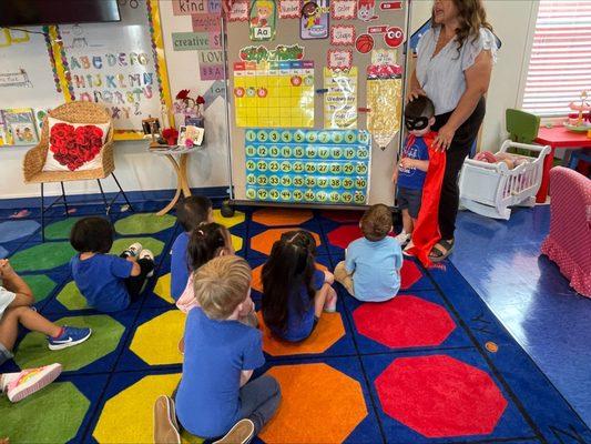 3 yr olds learning about the calendar and having a student of the day.