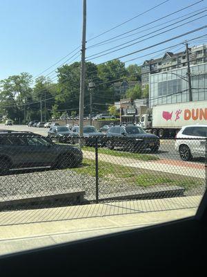 Cars backed up on the street waiting to pull in to service department