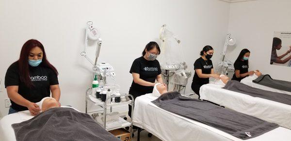 Esthetician Students Hand On Facial Drape.