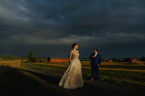 Bride and groom stand together during sunset  | JTobiason Photography