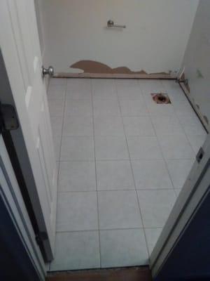 Bathroom floor is completed. Tile has been mortared to floor and grouted. Note* There is always a grout haze on tile during t...