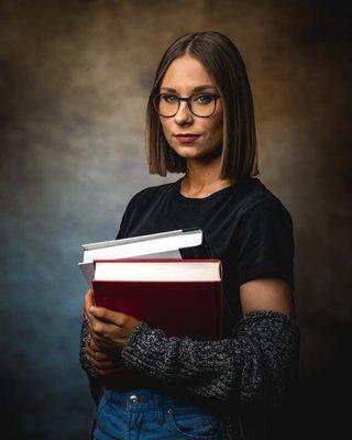 Nashville artist portrait woman holding books