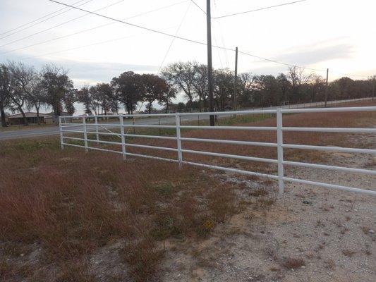 5 pipe fence after it was sandblasted and painted white