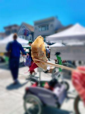 Having some gyoza at the farmers' market.