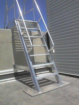 Ships Stairs or Ships Ladder that is crossing over a partial wall.  Notice that the roof is not penetrated with this installation.