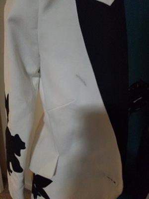 Brand new never been worn White House Black Marker blazer damaged by Dacula Cleaners.