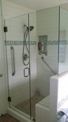 New shower with bench and grab bars.