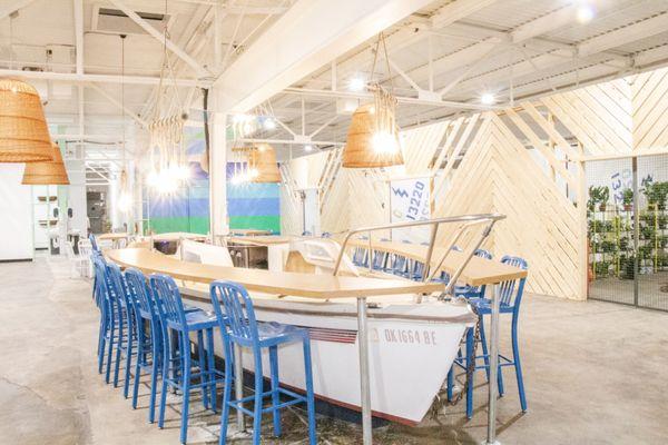 The bar is made from a sailboat that's lived its full life navigating earth's waters.