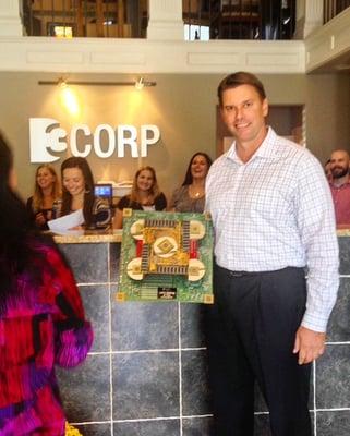 D3Corp owner, John Gehrig, holding his award for being in business for 20 years.