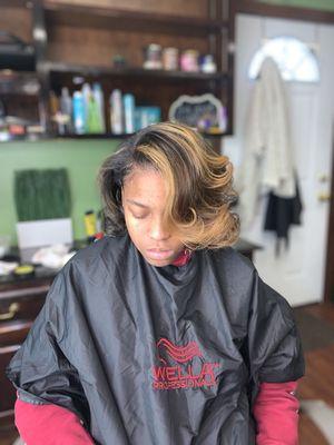 Natural hair blow out with partial highlights