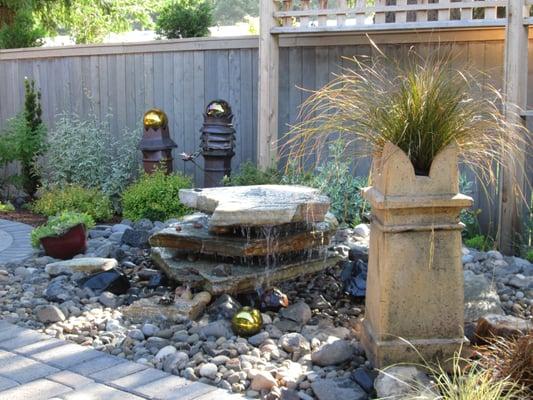 The bubbler fountain is in the central area of the back yard and is a main focal point. Landscaping Vancouver Washington