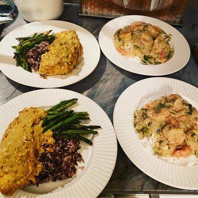 Shrimp étouffée, garlic ginger crusted salmon smothered in coconut curry sauce.