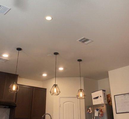 All the pendent light with previous builder grade recessed lights