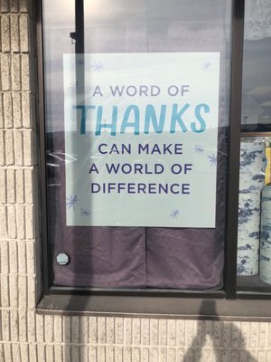 A sign in there window.