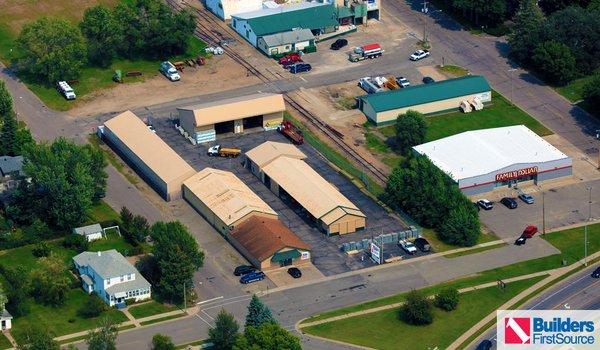 Building materials supplier Builders FirstSource's forklift is moving wood roof trusses.