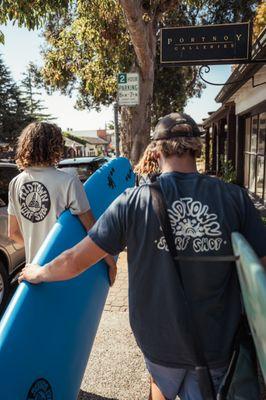 Surfers grab surfboards at Midtown Surf Shop in Carmel