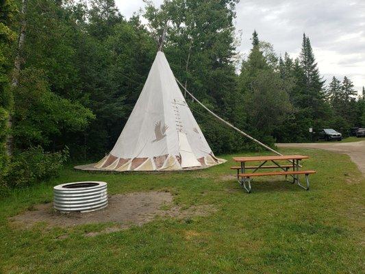 Site 31. Has a wood floor, double bunk beds & coat rack. Very short door. Strong smell of mildew. I couldn't sleep in it.