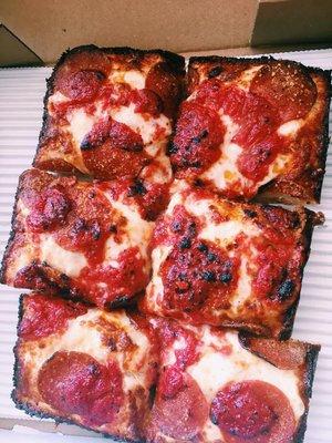 Small square with pepperoni- sauce on top. Delicious!