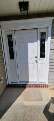 Freshly installed door with sidelights.