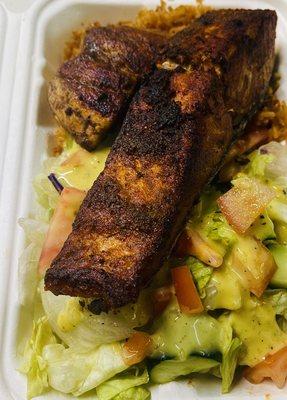 Blackened Salmon Afro Bowl: on a bed of Jollof rice with signature salad