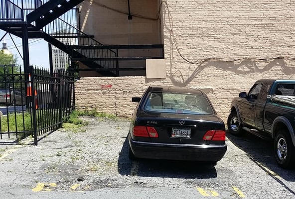 This parking lot on Peachtree Street wanted to address a security issue. They wanted to install a 10' tall fence to deter peo...