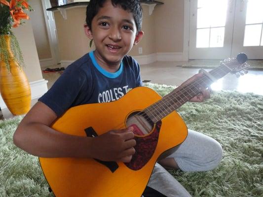 "I like to sing songs when I play guitar!" Sriki, 6