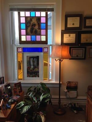 Afternoon sun streaming through stain glass windows.