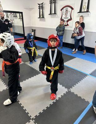 my son with the medal he just won