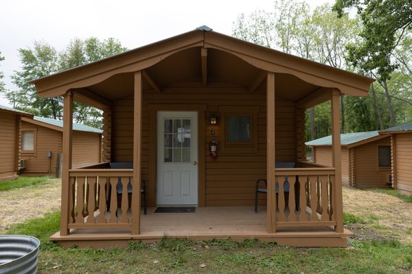 One step up from camping -- our log cabins! Beds & AC included.