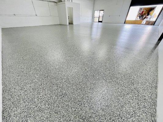 Commercial 3000 ft.² shop floor. Full broadcast system. Removed old coating and had this project complete within 5 Days.