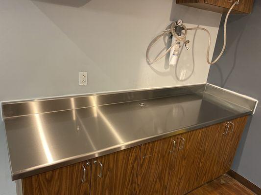 Stainless counter top for ice maker. Custom grommet for water lines