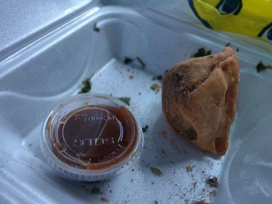 Veg Samosa with Tamarine Sauce. Make sure to get some cilantro sauce too, it compliments that flavors very well.