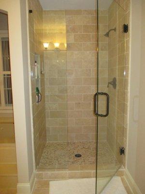 New shower and frameless glass enclosure