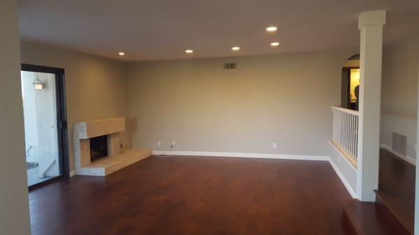 After - living room.  Notice the floors, paint and fireplace!!!