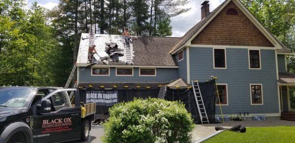 Stripping off old asphalt to be replaced with our new Classic Bronze Standing Seam Metal Roof.