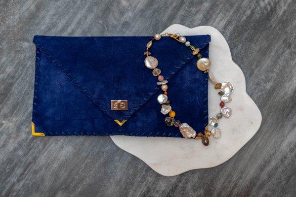 Unique jewelry and a stylish colorful clutch