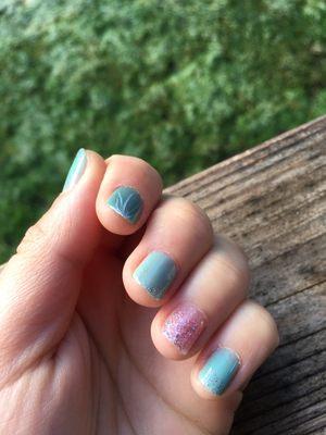 Turquoise polished nails with pink sparkly accents